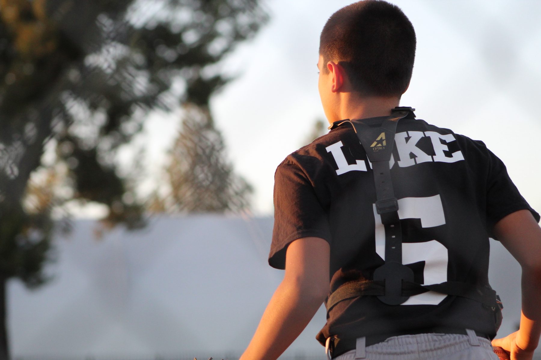 Luke Sevilla in catcher gear, number 5