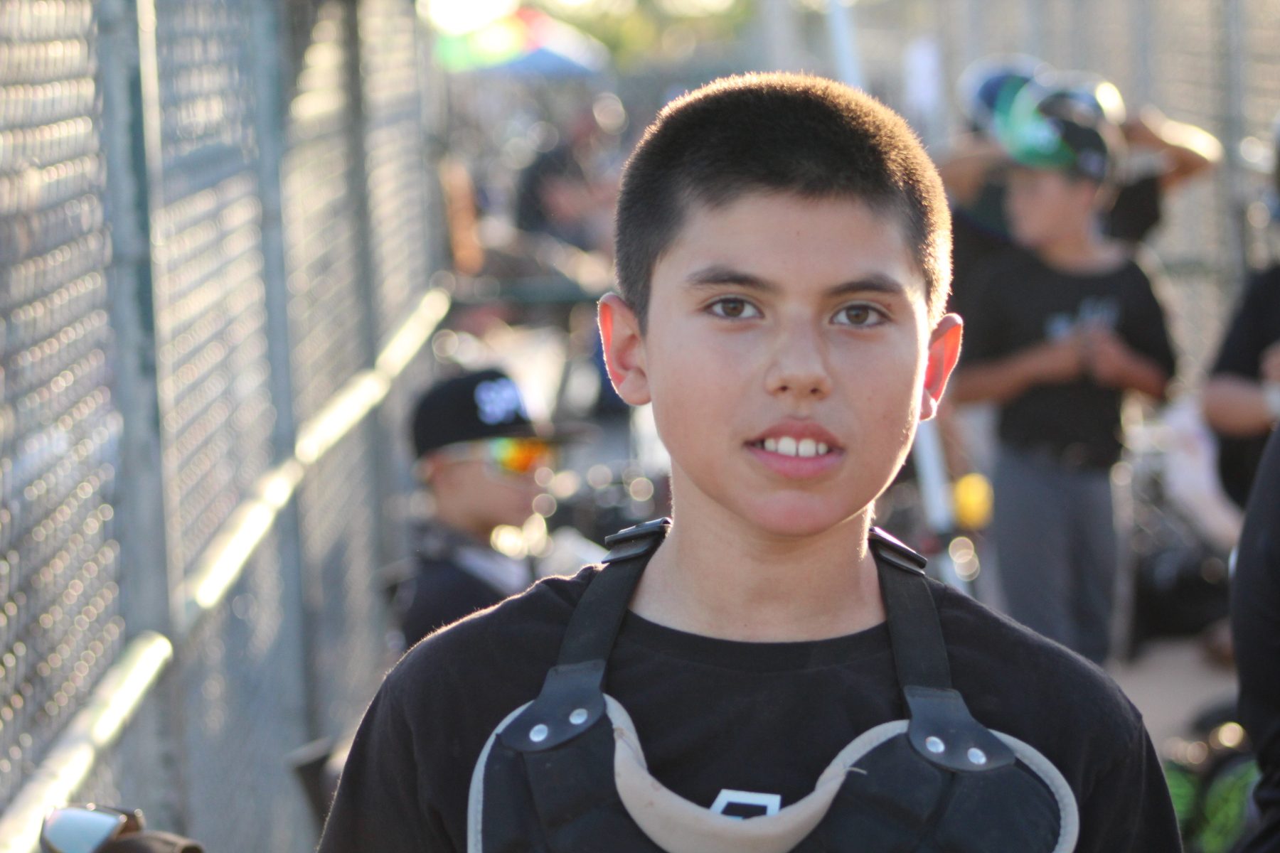 Portrait of Luke Sevilla in baseball catcher gear