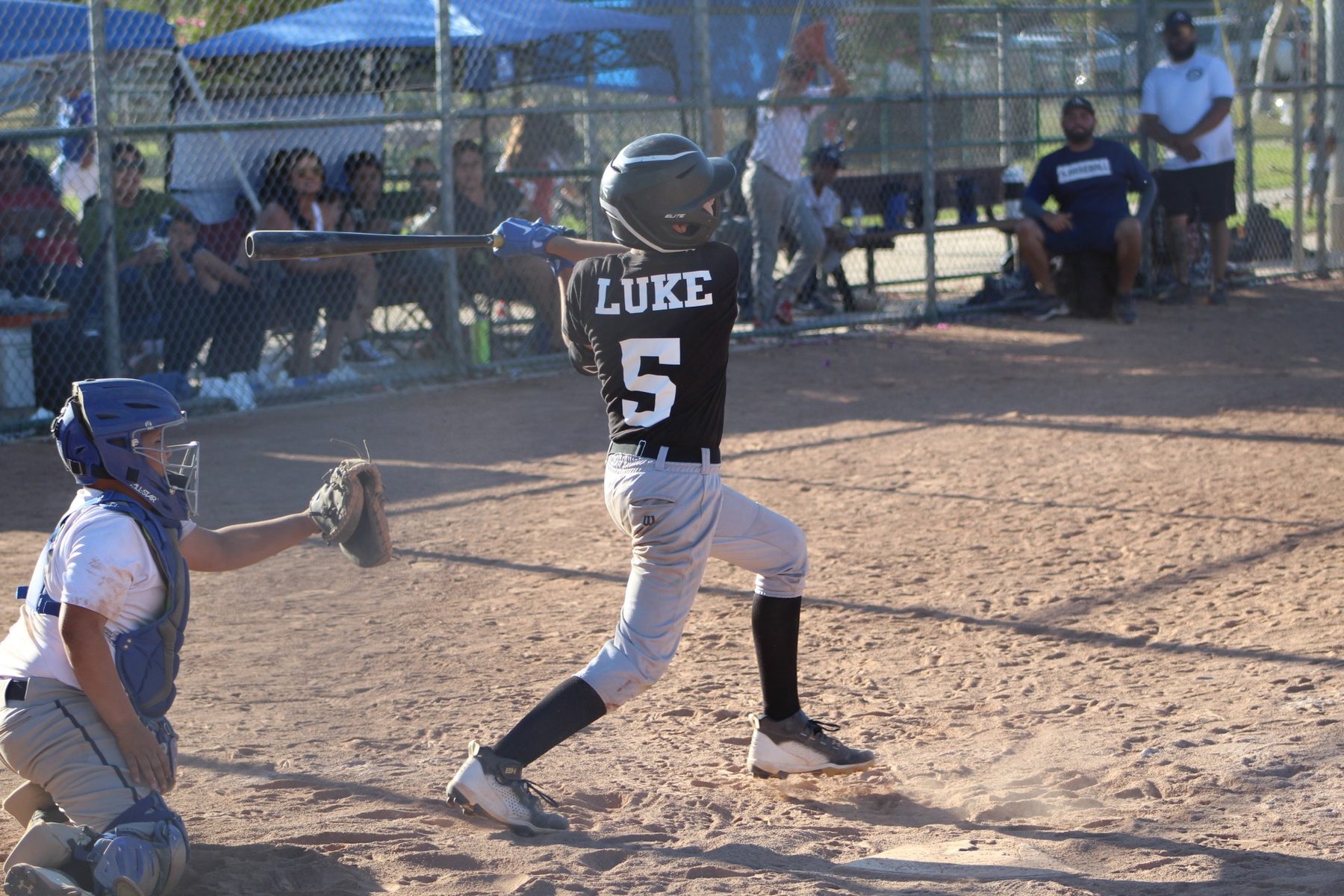 Luke Sevilla completing a baseball swing