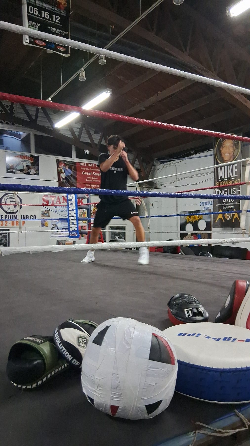 Luke Sevilla training footwork inside a boxing ring