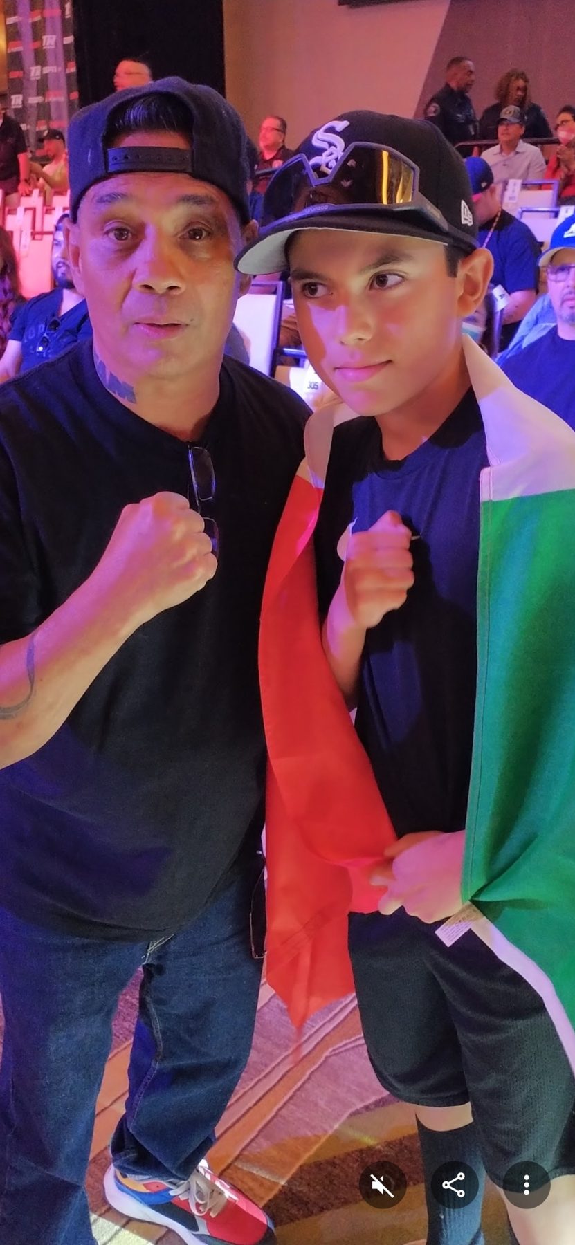 Young Luke Sevilla with a boxing personality at an event