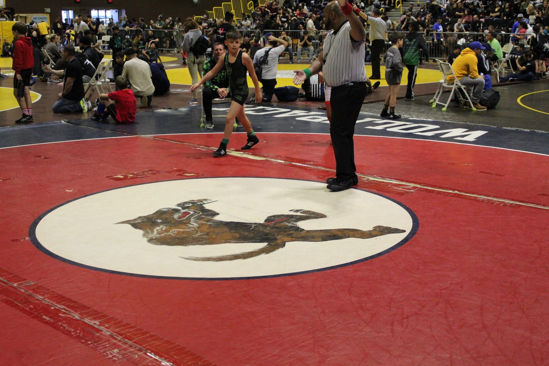 Luke Sevilla standing after youth wrestling action