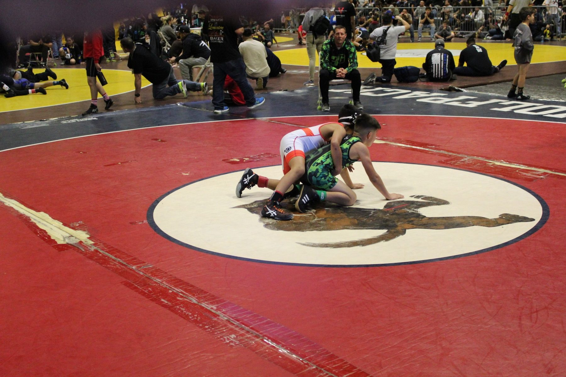 Luke Sevilla controlling an opponent in youth wrestling